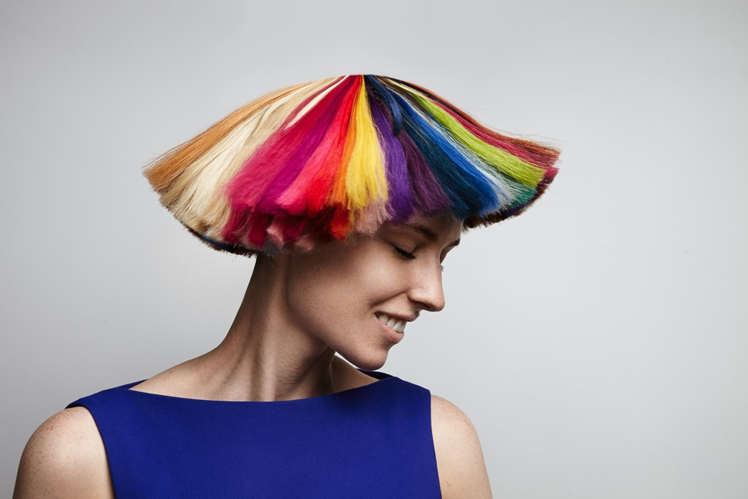 woman shake her rainbow color hair